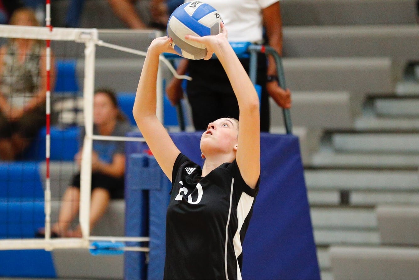 Ashley Neubert (20) sets a ball for Gibbs during the Lady Eagles' victory at Karns on Monday, Sept. 10, 2018.