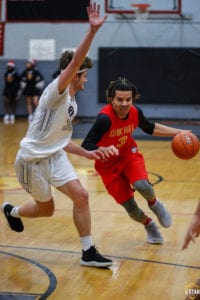 Oak Hill Academy guard Cole Anthony drives against Grace Christian guard C.J. Gettelfinger on Saturday, Dec. 15, 2018. (Photo: Danny Parker)